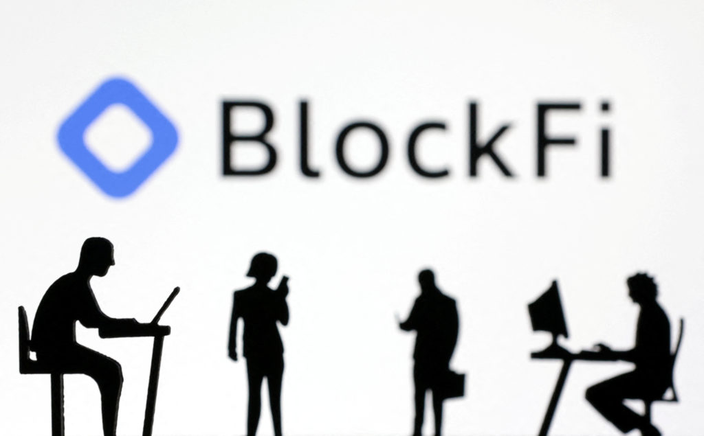 Figurines with smartphones and computers are seen in front of the BlockFi logo in this illustration, November 28, 2022. REUTERS/Dado Ruvic/Illustration