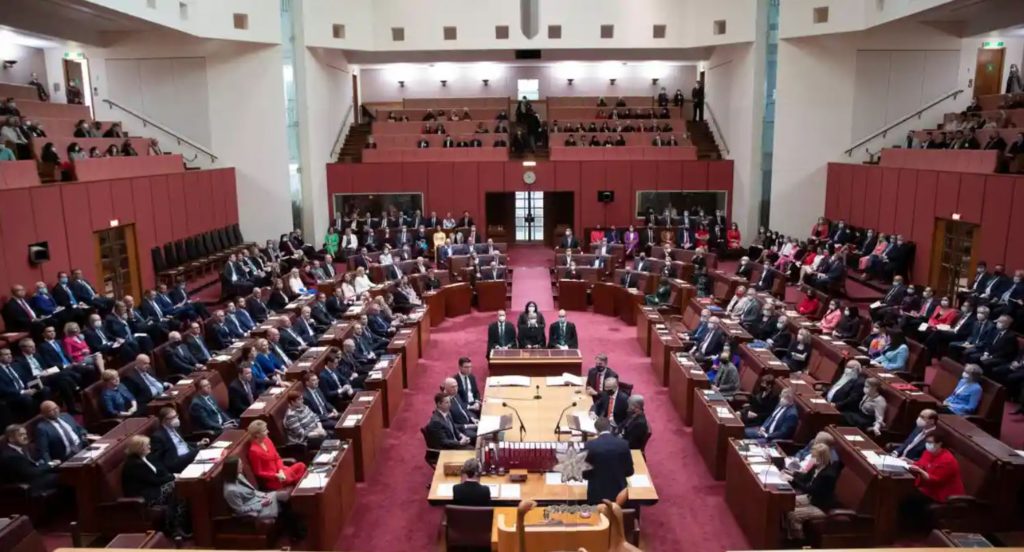 The Senate has red seats and carpet, with 76 senators that represent states and territories. The House of Representatives has green seats and carpet, with 151 members that each represent an electorate. Photograph: Mike Bowers/The Guardian