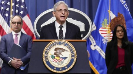 Attorney General Merrick Garland, joined by Associate Attorney General Vanita Gupta and Assistant Attorney General Jonathan Kanter of the Justice Department's Antitrust Division, speaks at the Department of Justice in Washington, Tuesday, Jan. 24, 2023. The Justice Department and several states have sued Google, alleging that its dominance in digital advertising harms competition. (AP Photo/Carolyn Kaster)