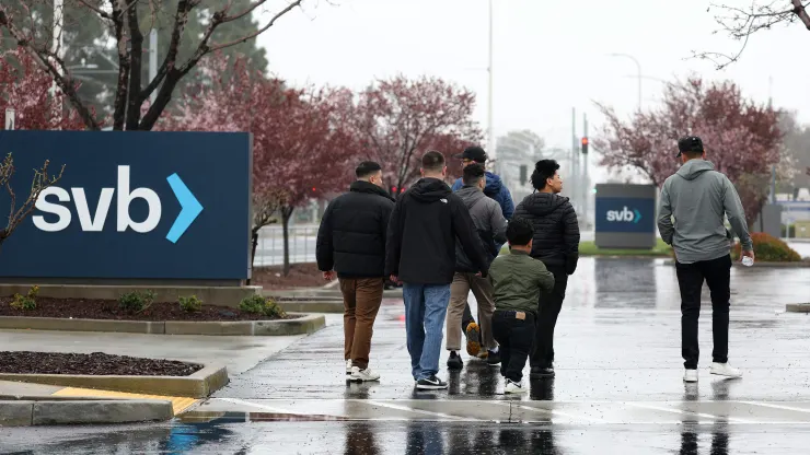 Employees stand outside of the shuttered Silicon Valley Bank (SVB) headquarters on March 10, 2023 in Santa Clara, California. Justin Sullivan | Getty Images