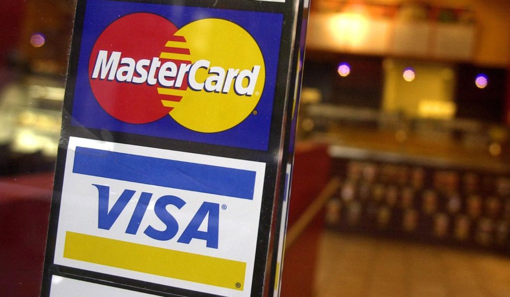 Visa, and Mastercard pause work on new payments code for firearms sellers