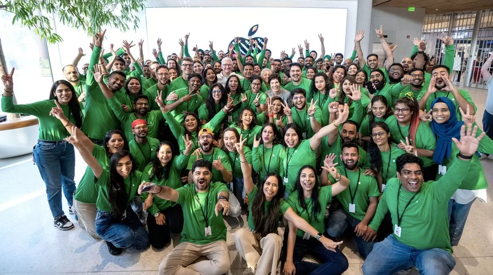 Mr Cook shared a photo of himself with Apple Store employees on Monday