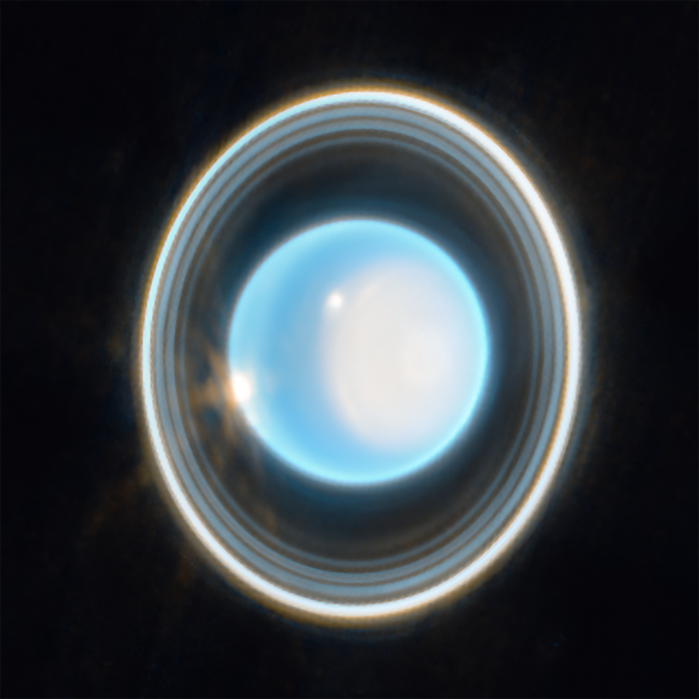 This zoomed-in image of Uranus, captured by Webb’s Near-Infrared Camera (NIRCam) Feb. 6, 2023, reveals stunning views of the planet’s rings. The planet displays a blue hue in this representative-color image, made by combining data from two filters (F140M, F300M) at 1.4 and 3.0 microns, which are shown here as blue and orange, respectively Credits: NASA, ESA, CSA, STScI. Image processing: J. DePasquale (STScI)