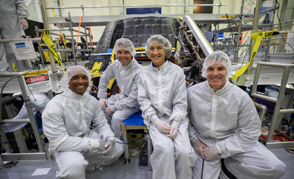 Artemis II crew members inspect their Orion crew module inside the high bay of the Neil A. Armstrong Operations and Checkout Building at NASA’s Kennedy Space Center in Florida, on Aug. 7, 2023.