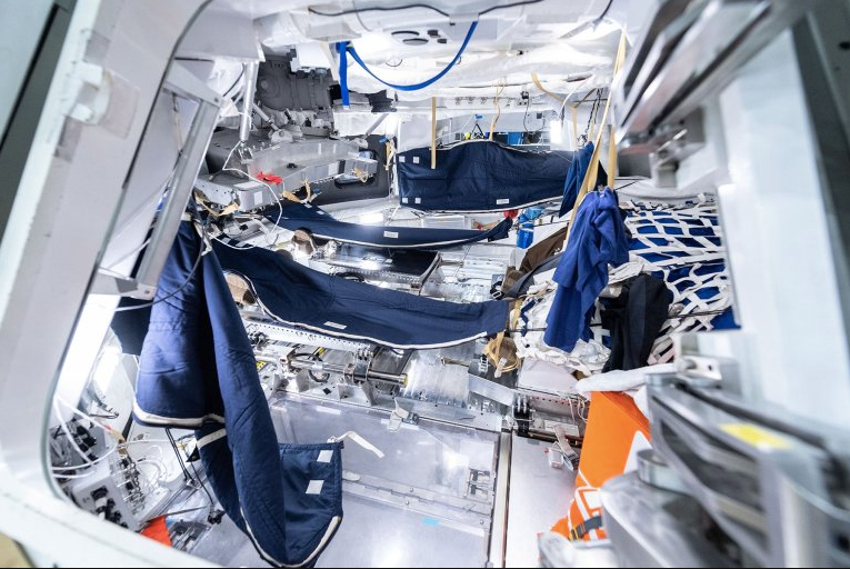 Artemis II crew sleeping bag configurations are tested in the Orion spacecraft medium-fidelity mockup at NASA’s Johnson Space Center in Houston, used for astronaut training and systems familiarization.