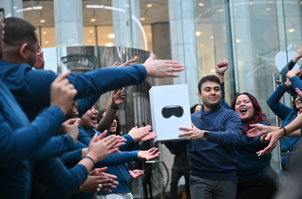 The first customer walks out of the Apple Store with his purchase of the Vision Pro headset on February 2, 2024. Angela Weiss/AFP/Getty Images