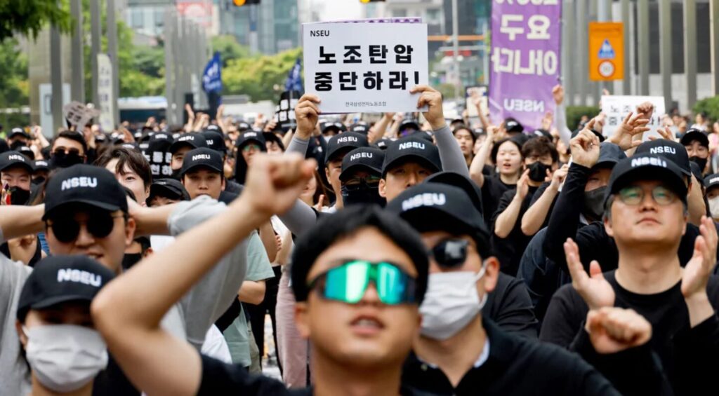 A union holds a placard that says "stop union busting" in front of the Samsung Electronics Seocho Building in Seoul on May 24, 2024. Soo-hyeon Kim/Reuters