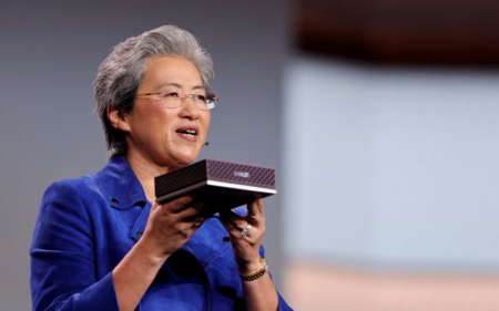 Lisa Su, CEO of AMD, holds an AMD Ryzen AI Halo Developer Platform